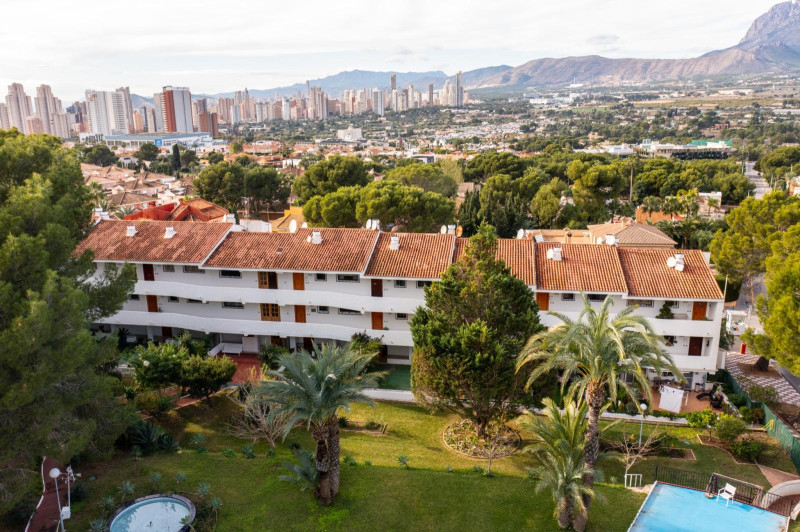 A residential building set among gardens at Ciudad Patricia resort, Benidorm
